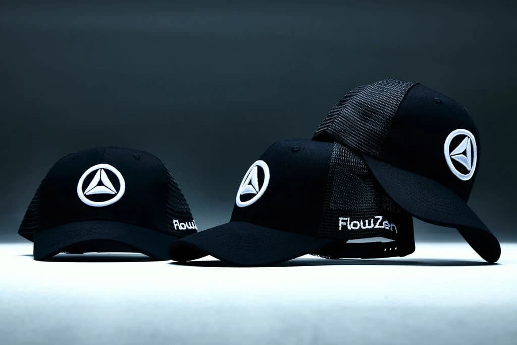Two FlowZen trucker caps together